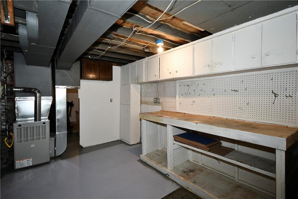 335 Mercer Street Turtle Creek, PA 15145 - Photo 18 of 25 a view of storage and utility room with racks on the wall