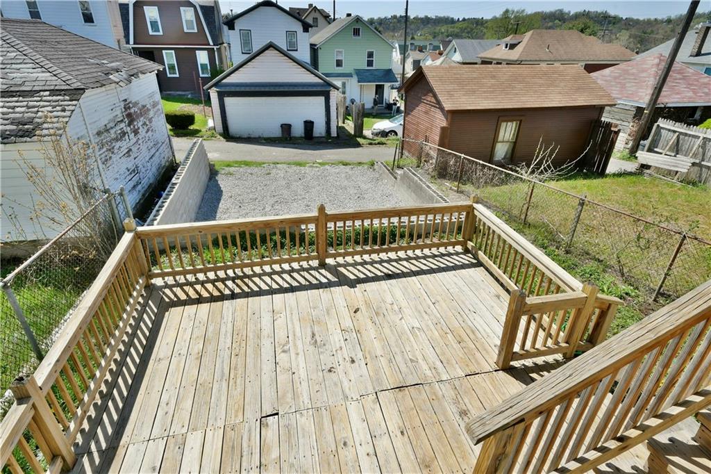 335 Mercer Street Turtle Creek, PA 15145 - Photo 22 of 25 a roof deck with couch and wooden fence