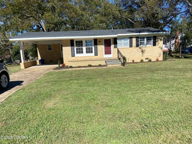 front view of a house with a yard