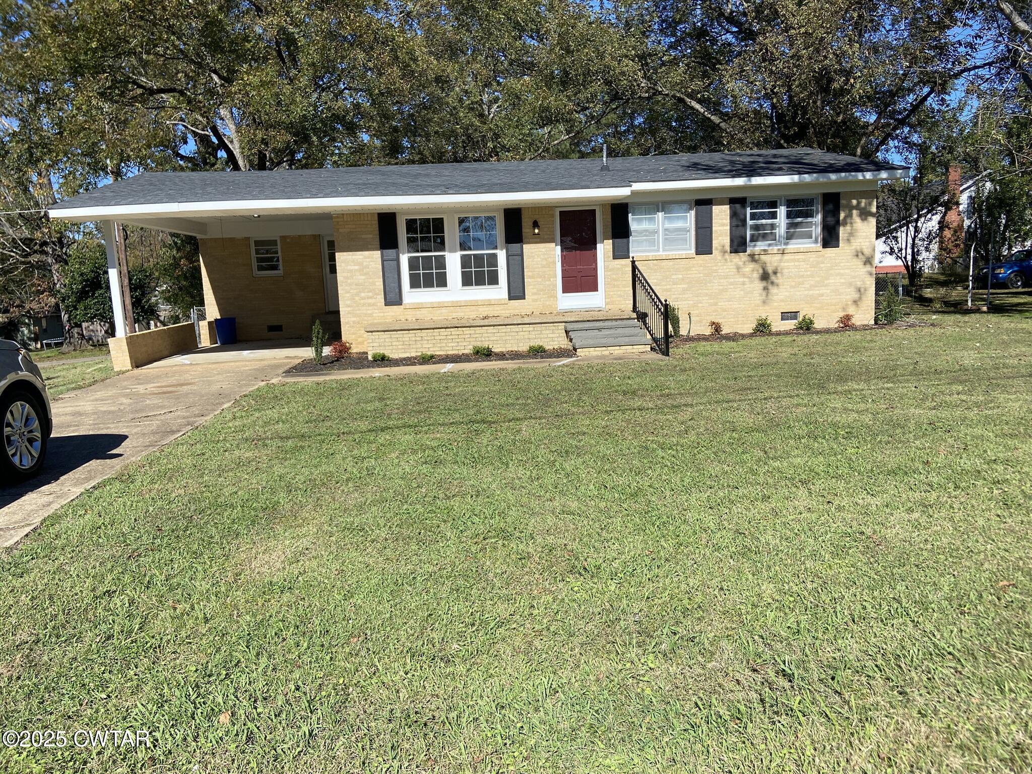 front view of a house with a yard