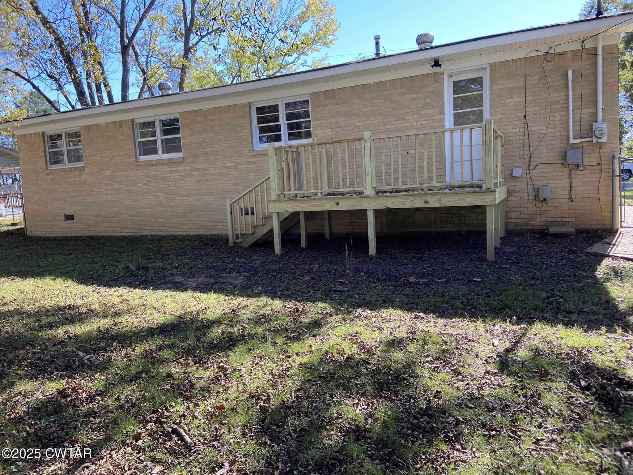 437 East 2nd Street Henderson, TN 38340 - Photo 11 of 16 a house view with a backyard