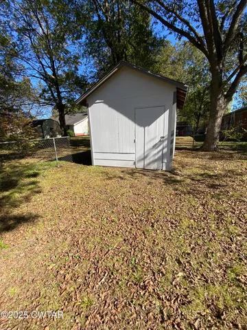 a house with trees in front of it