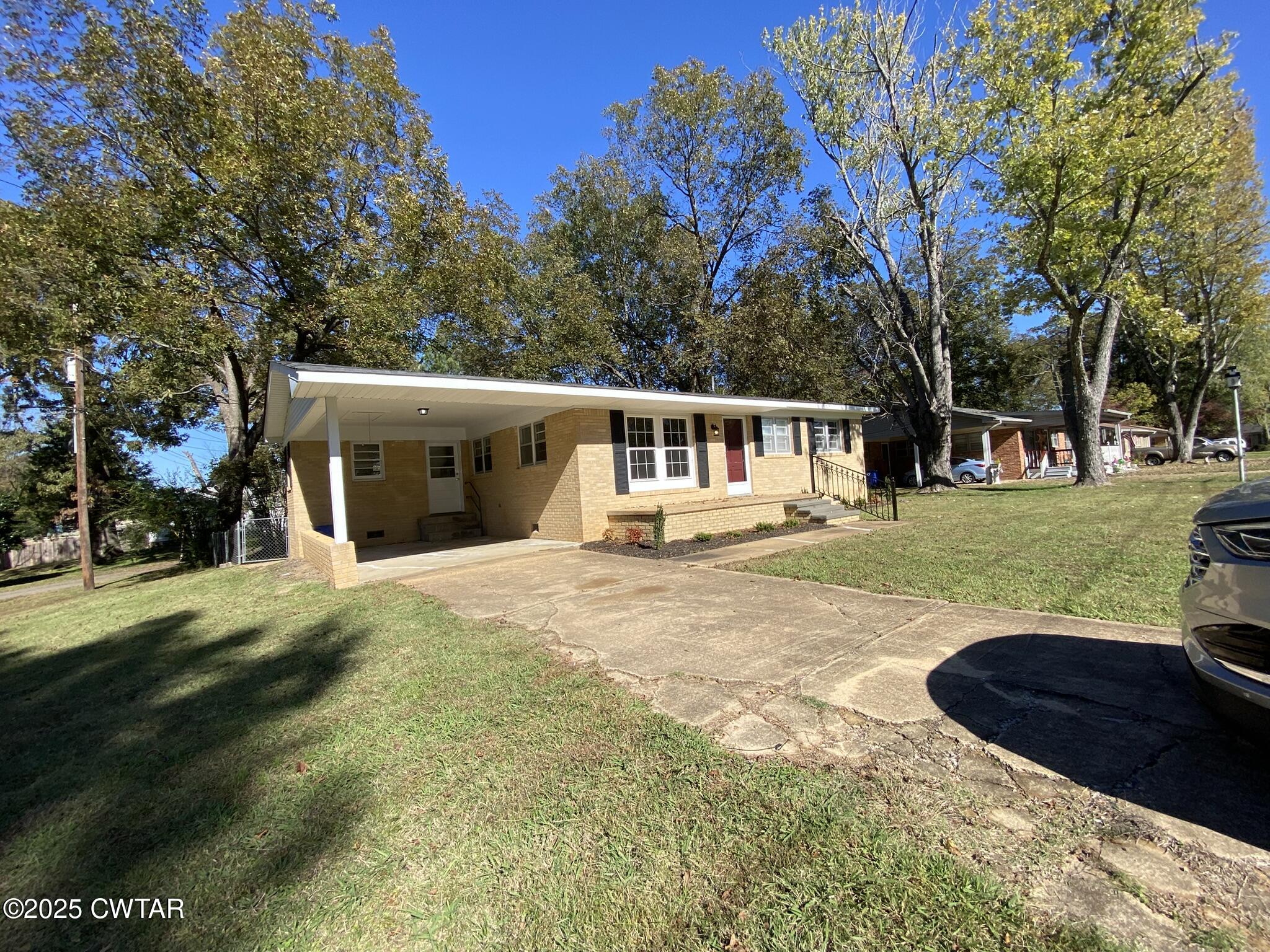 437 East 2nd Street Henderson, TN 38340 - Photo 15 of 16 a view of a house with a yard and tree s