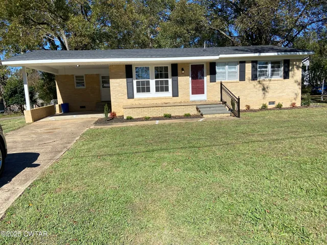 front view of a house with a yard