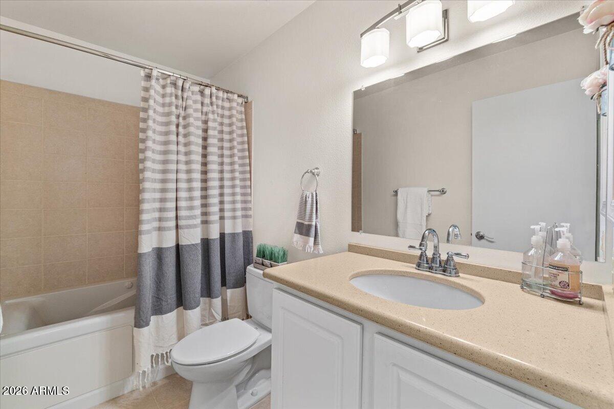 5525 East Thomas Road, Unit O12 Phoenix, AZ 85018 - Photo 11 of 27 a bathroom with a sink toilet and shower