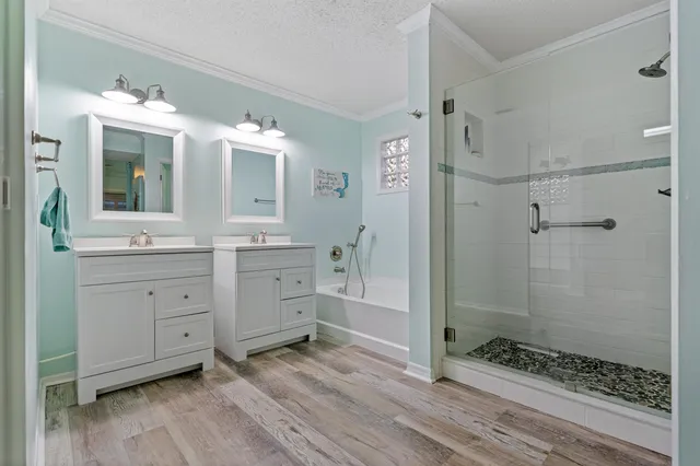 a bedroom with furniture and a large window