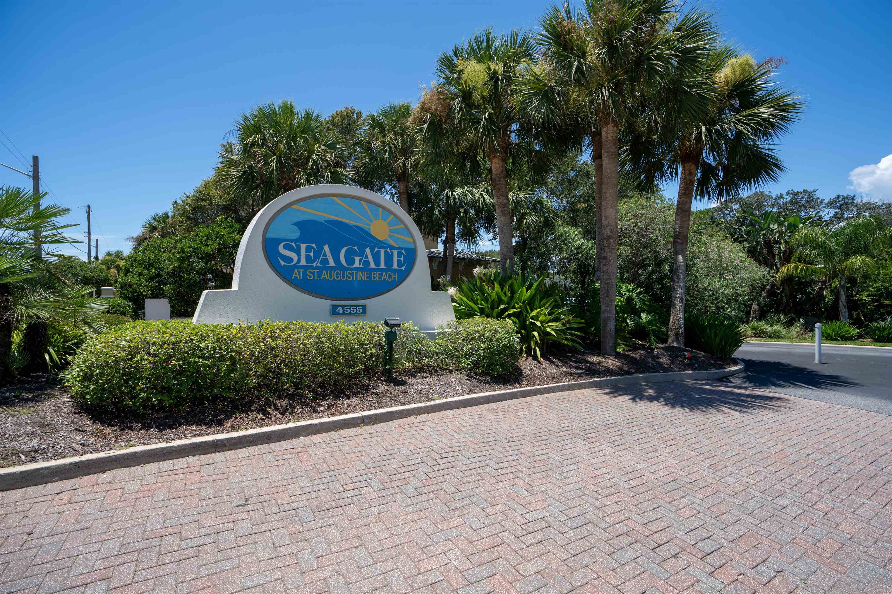 362 Monika Place St. Augustine, FL 32080 - Photo 31 of 44 a sign board with flower plants and large trees