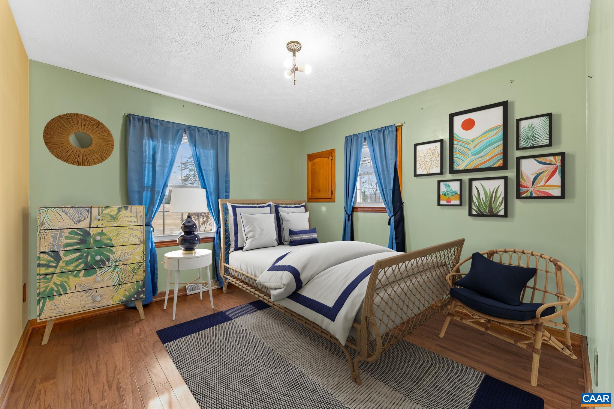 987 Matthew Mill Road Ruckersville, VA 22968 - Photo 20 of 63 a bedroom with a bed and a table