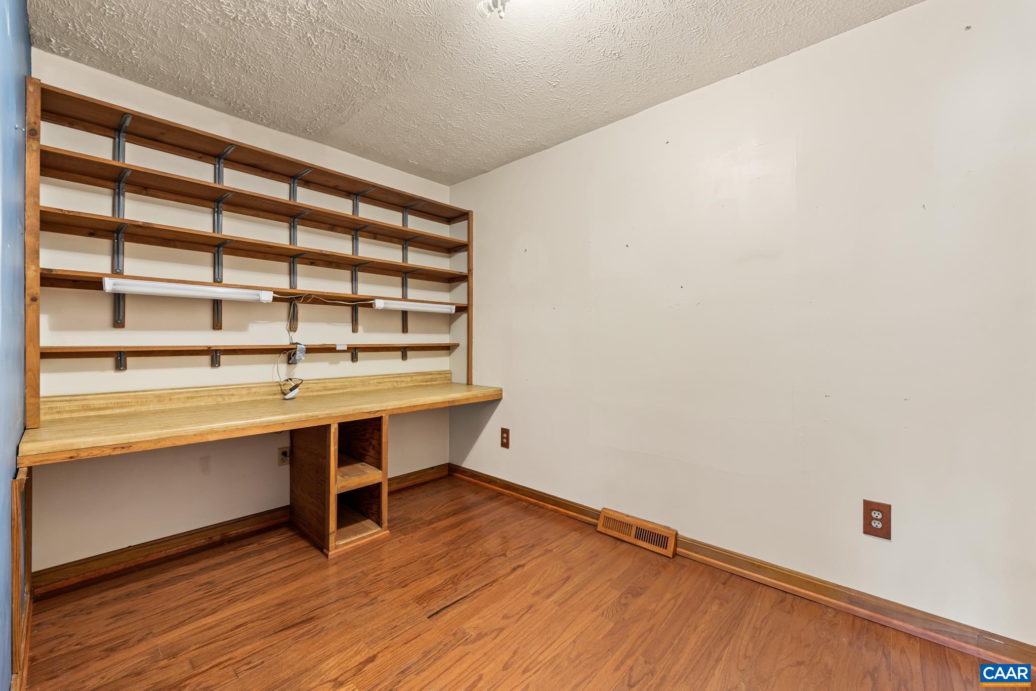 987 Matthew Mill Road Ruckersville, VA 22968 - Photo 24 of 63 a view of a room with wooden floor and small window