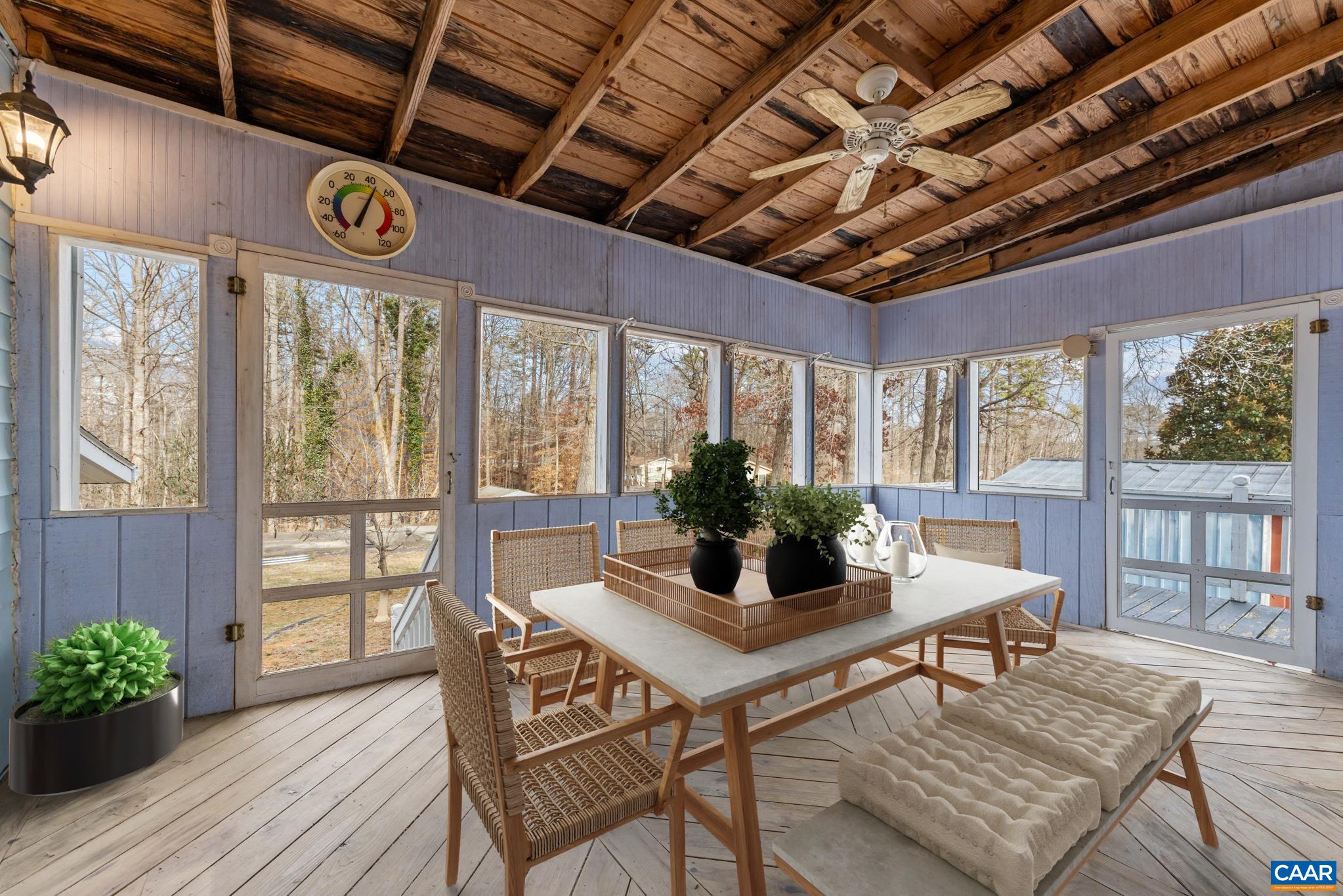 987 Matthew Mill Road Ruckersville, VA 22968 - Photo 2 of 63 a dining room with furniture a chandelier and wooden floor