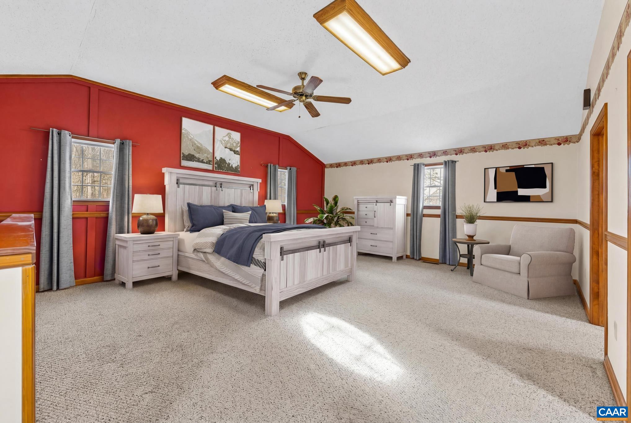 987 Matthew Mill Road Ruckersville, VA 22968 - Photo 32 of 63 a bedroom with furniture and a chandelier