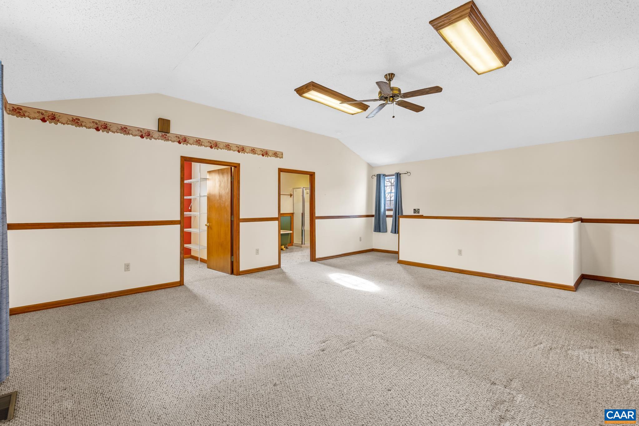 987 Matthew Mill Road Ruckersville, VA 22968 - Photo 34 of 63 a view of a livingroom with a refrigerator a ceiling fan and a refrigerator
