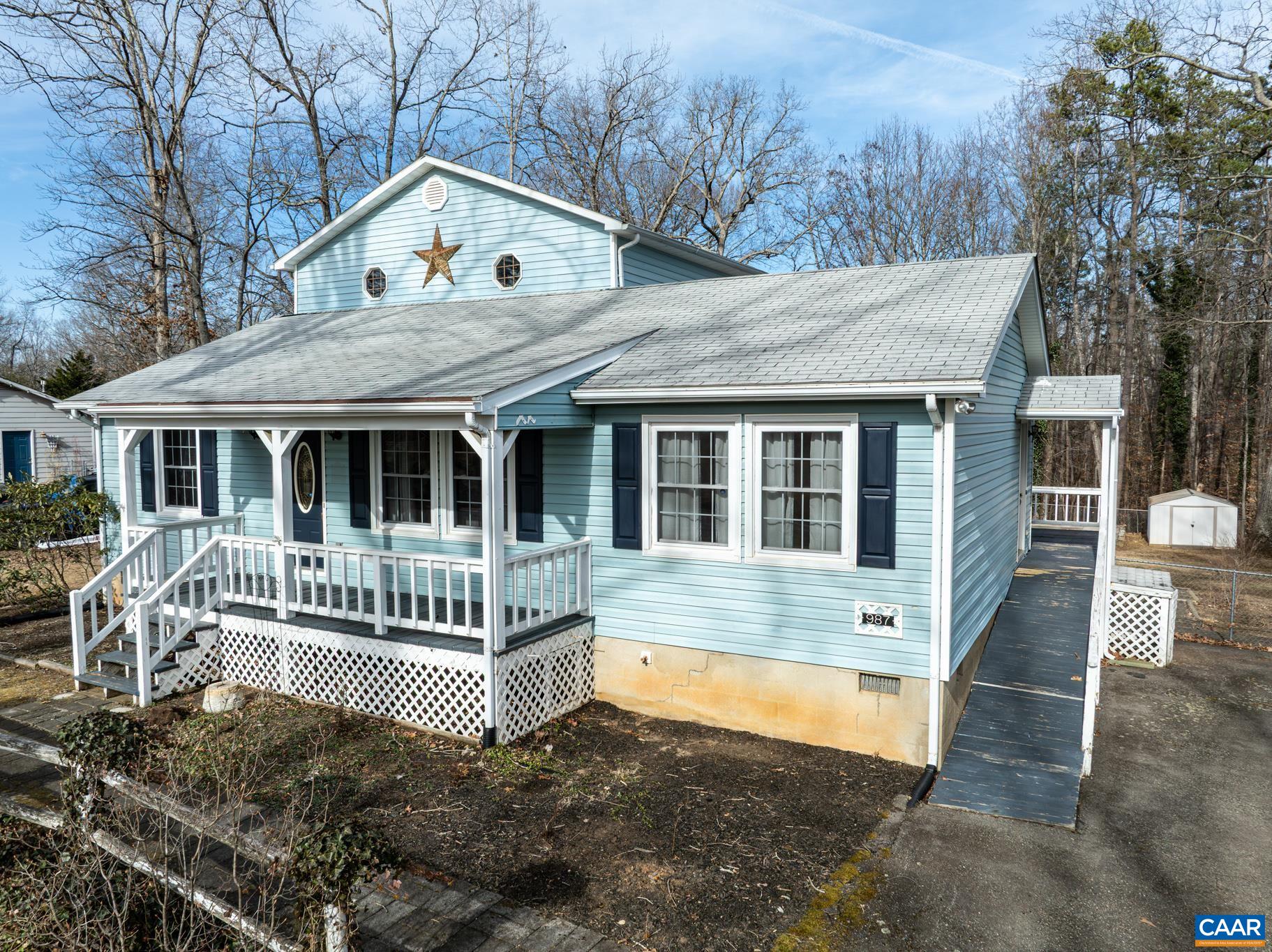 987 Matthew Mill Road Ruckersville, VA 22968 - Photo 46 of 63 a view of house with a yard from a large tree