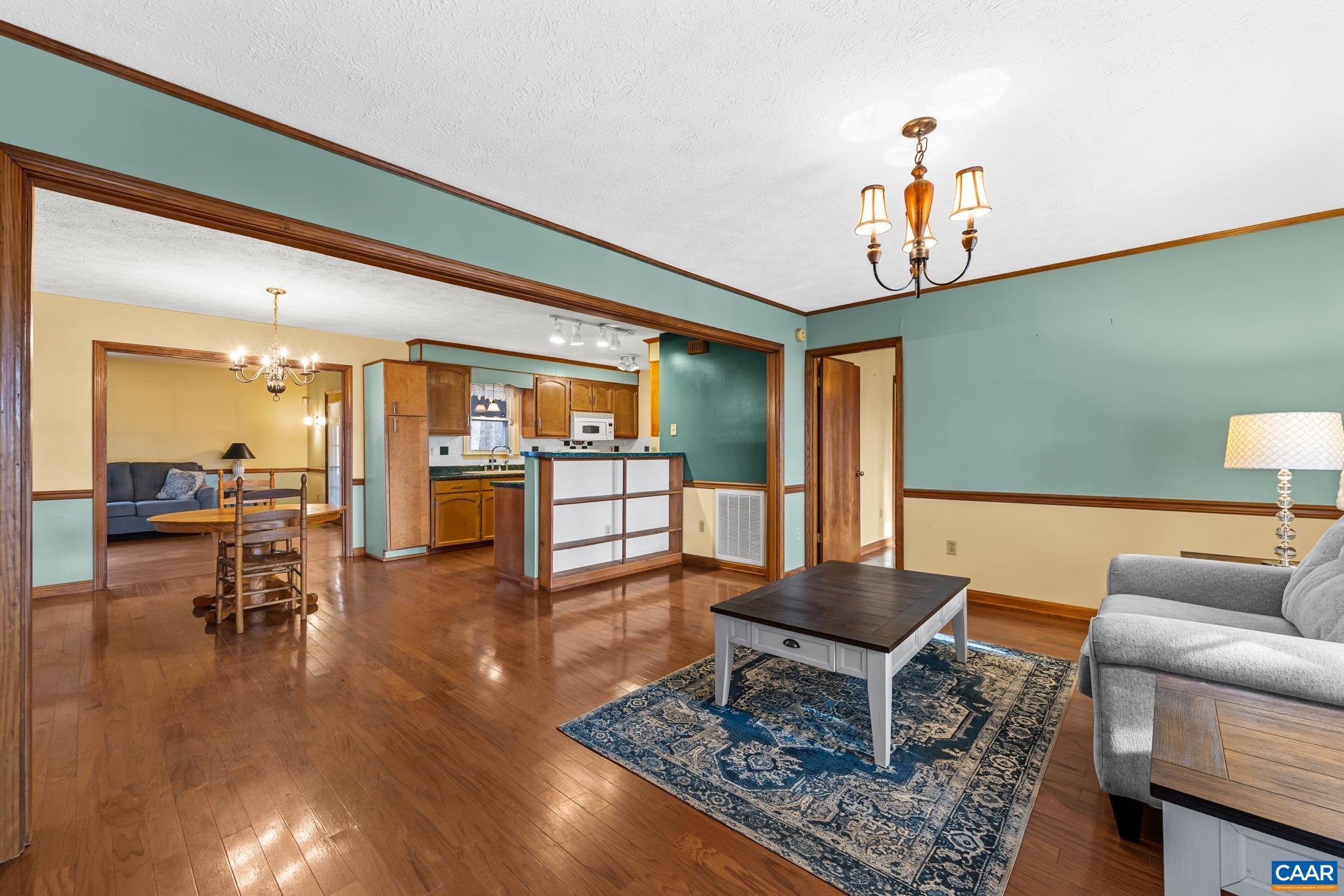 987 Matthew Mill Road Ruckersville, VA 22968 - Photo 4 of 63 a living room with furniture and a table