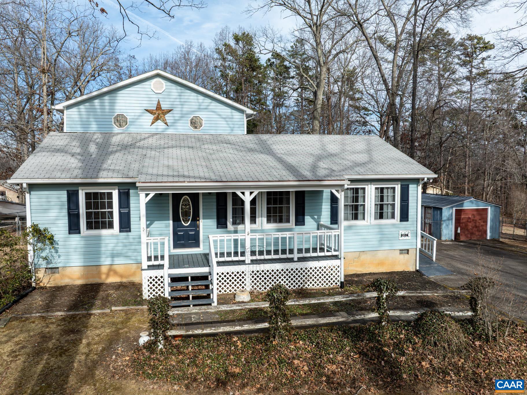 987 Matthew Mill Road Ruckersville, VA 22968 - Photo 5 of 63 a front view of a house with a yard