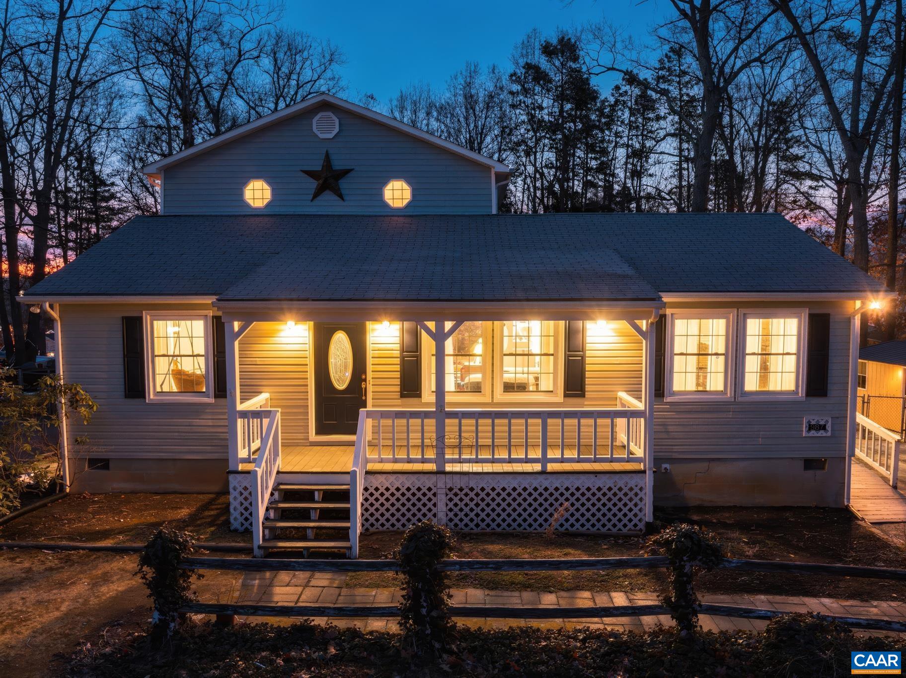 987 Matthew Mill Road Ruckersville, VA 22968 - Photo 7 of 63 a front view of a house with a yard