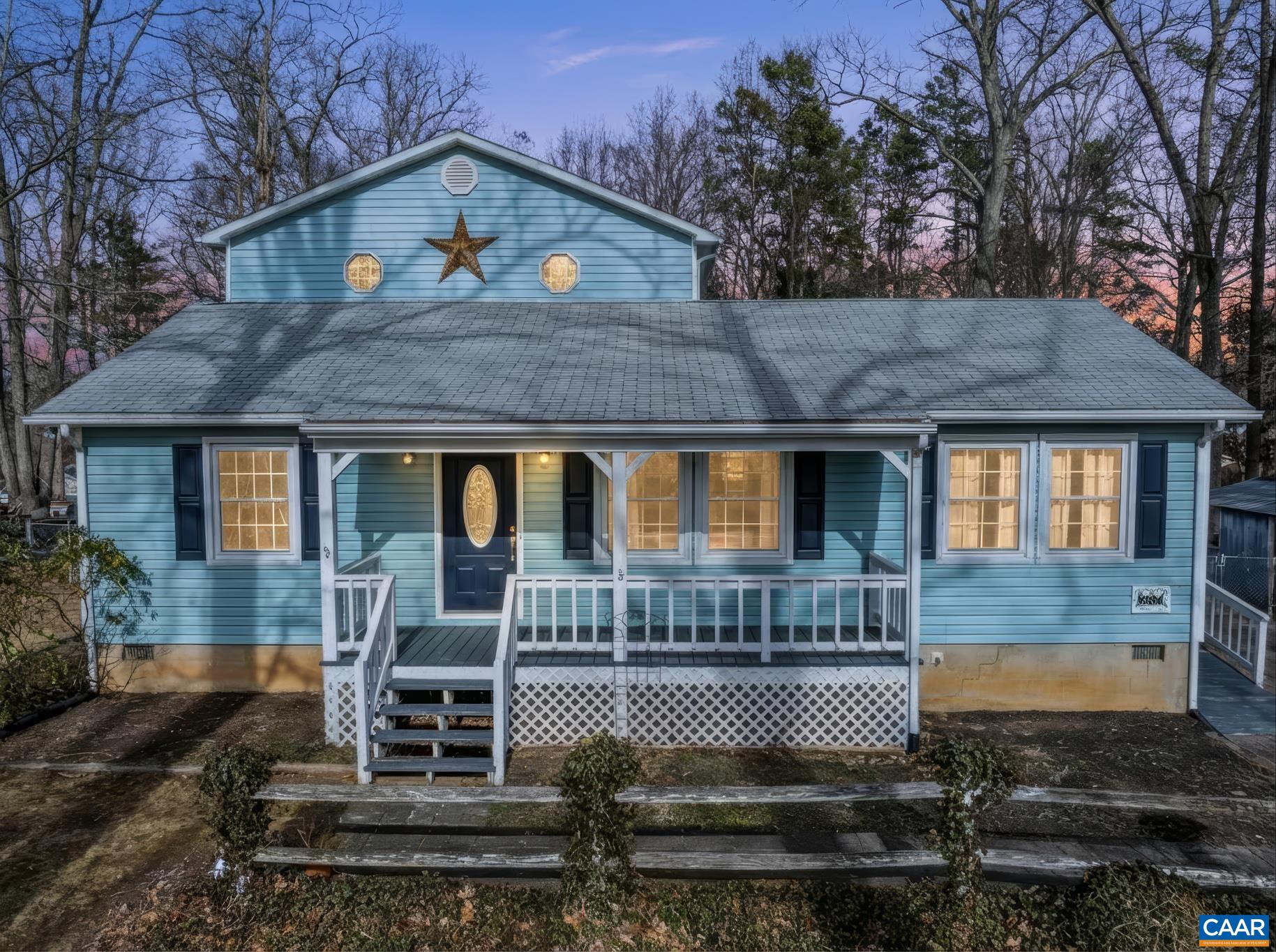 987 Matthew Mill Road Ruckersville, VA 22968 - Photo 8 of 63 a front view of a house with plants