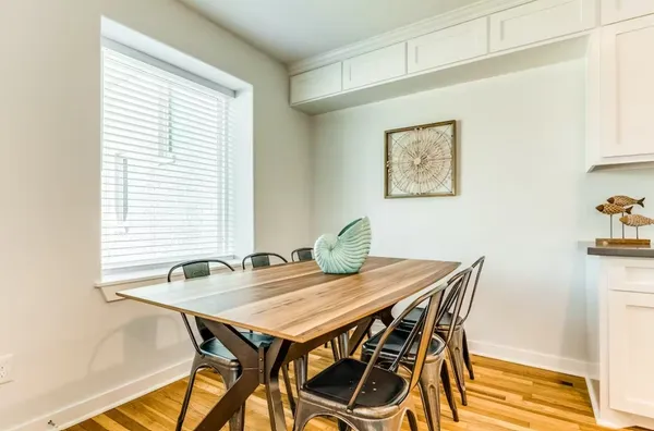 a view of a dining table and chairs in a room