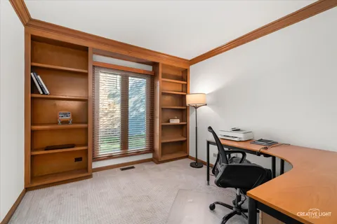 a view of a workspace with furniture