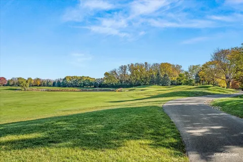 a view of a lake with a big yard