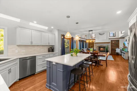 a open kitchen with stainless steel appliances granite countertop a stove and cabinets