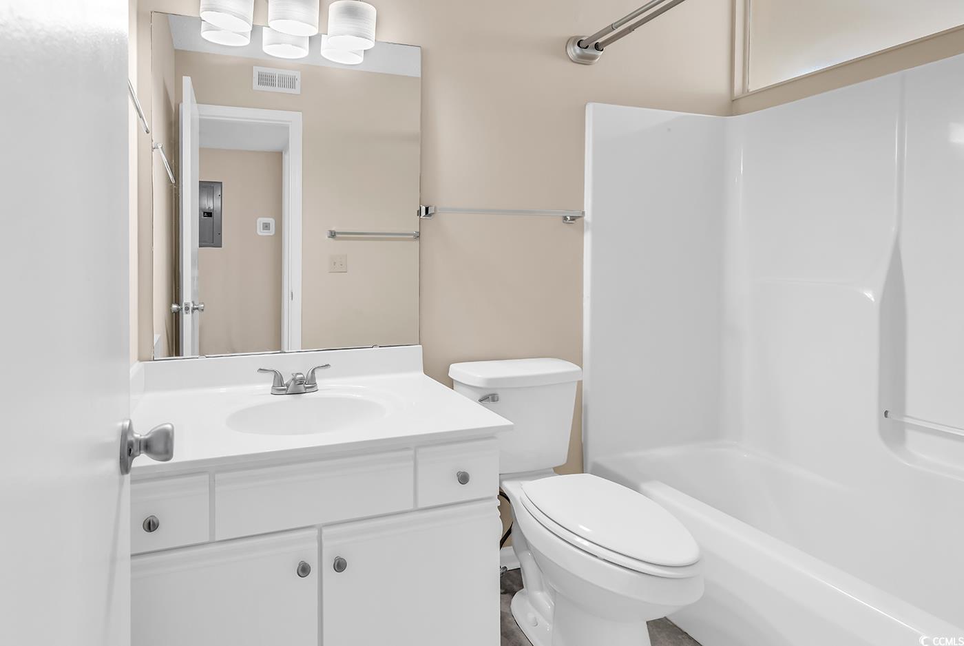 8796 Chandler Drive, Unit F Surfside Beach, SC 29575 - Photo 14 of 21 Full bathroom featuring vanity, shower / bathtub combination, and electric panel