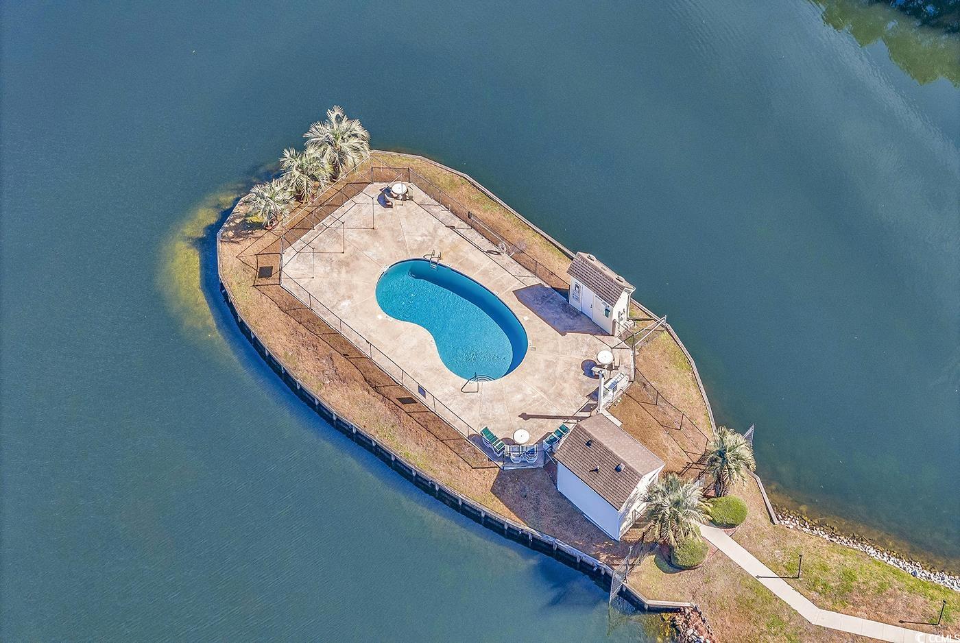 8796 Chandler Drive, Unit F Surfside Beach, SC 29575 - Photo 21 of 21 Bird's eye view of a pool area
