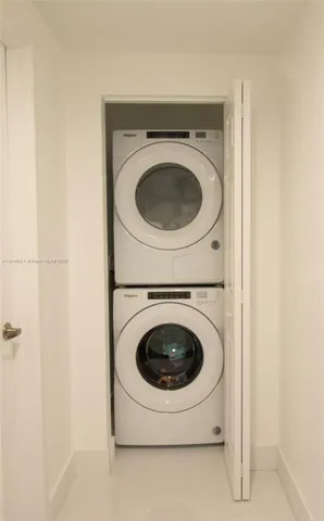 a bedroom with a bed and a mirror