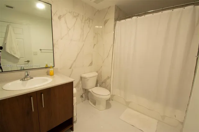 a kitchen with a sink stove and microwave