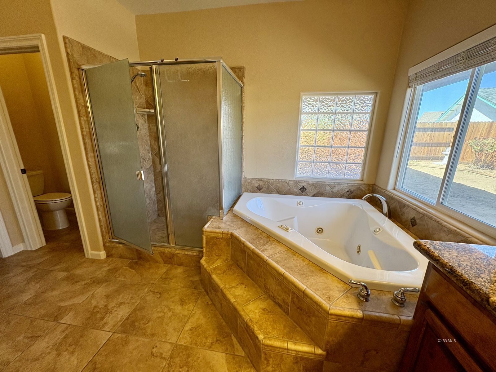 416 Olive Avenue Ridgecrest, CA 93555 - Photo 14 of 35 a bathroom with a tub and a shower