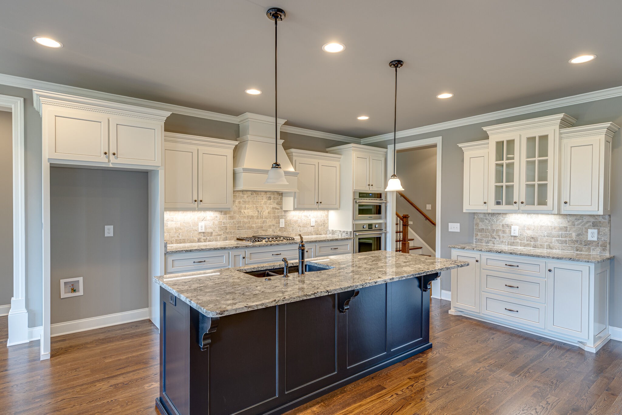 2040 Imagine Circle Spring Hill, TN 37174 - Photo 13 of 51 a kitchen with counter top space cabinets and wooden floor
