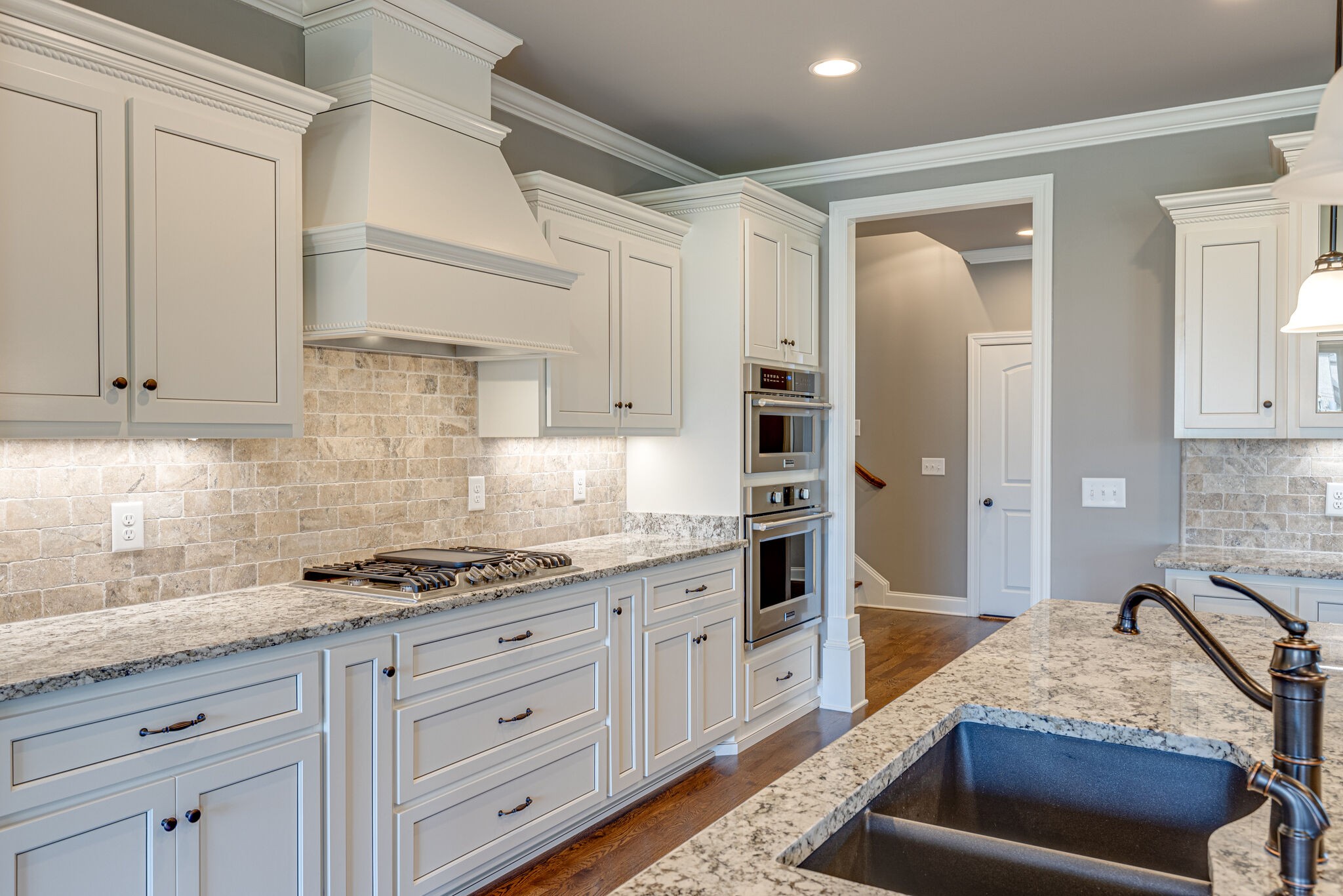 2040 Imagine Circle Spring Hill, TN 37174 - Photo 16 of 51 a kitchen with granite countertop a sink stove and cabinets