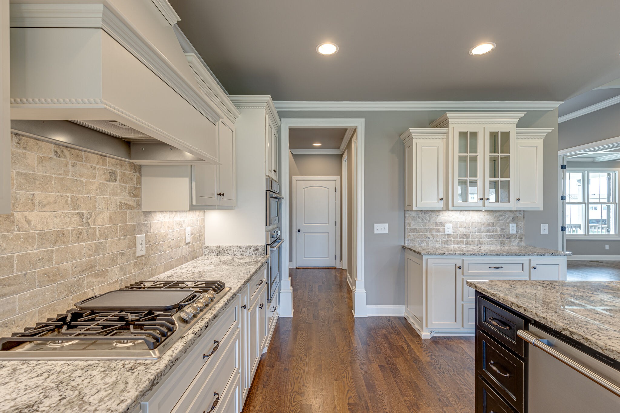 2040 Imagine Circle Spring Hill, TN 37174 - Photo 17 of 51 a large kitchen with granite countertop a stove and a sink