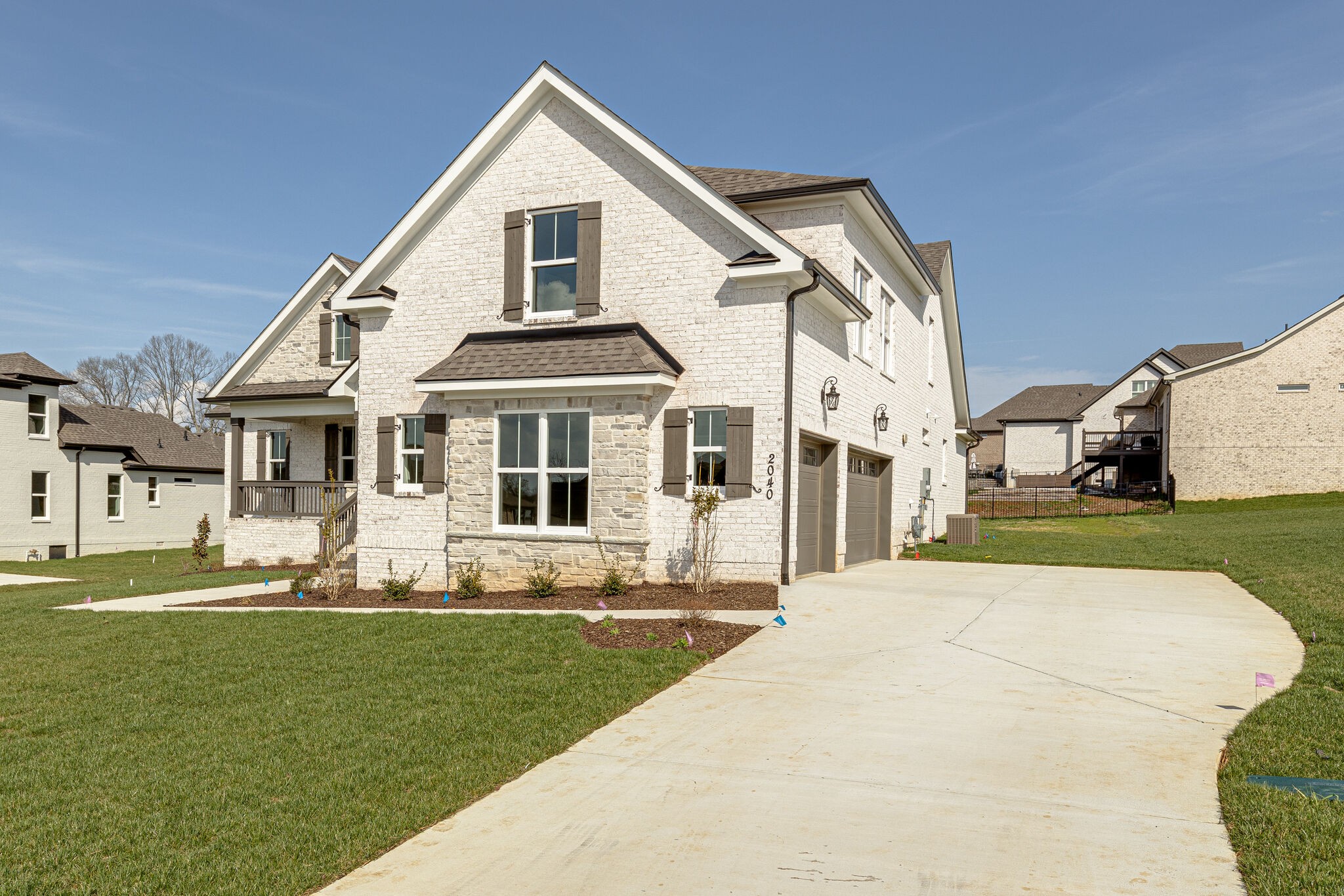 2040 Imagine Circle Spring Hill, TN 37174 - Photo 3 of 51 a front view of a house with a yard