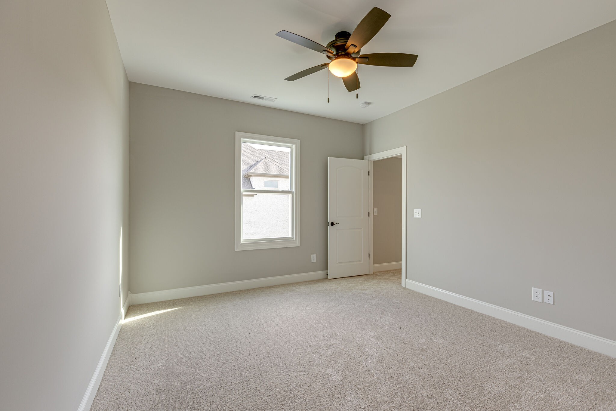 2040 Imagine Circle Spring Hill, TN 37174 - Photo 39 of 51 an empty room with a ceiling fan and a window