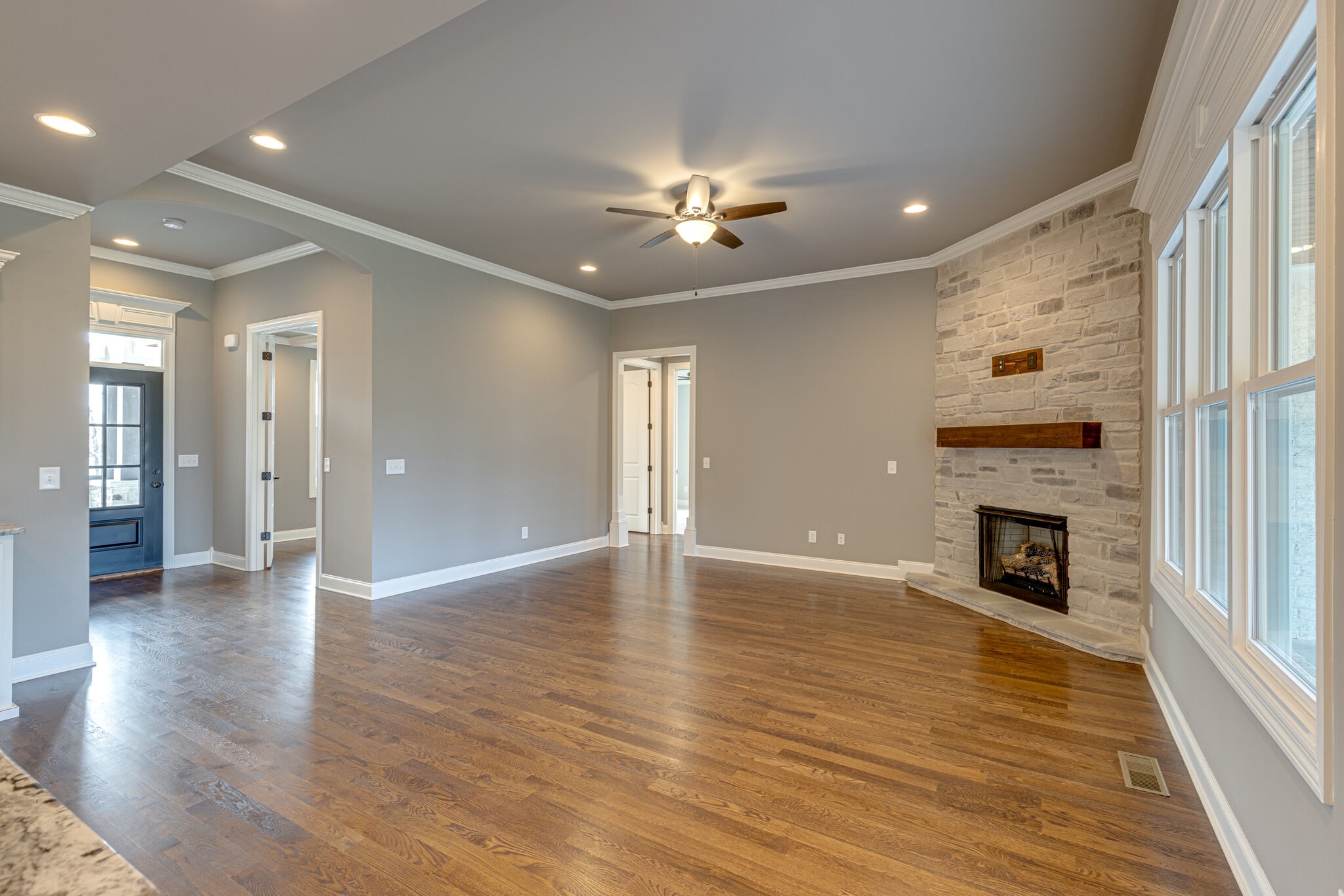 2040 Imagine Circle Spring Hill, TN 37174 - Photo 10 of 51 a view of an empty room with wooden floor fireplace and a window