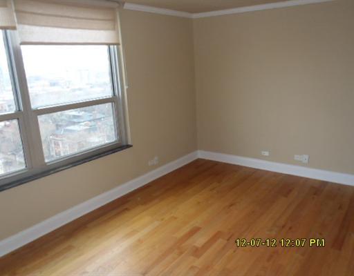 720 West Gordon Terrace, Unit 15L Chicago, IL 60613 - Photo 4 of 12 a view of an empty room with a window