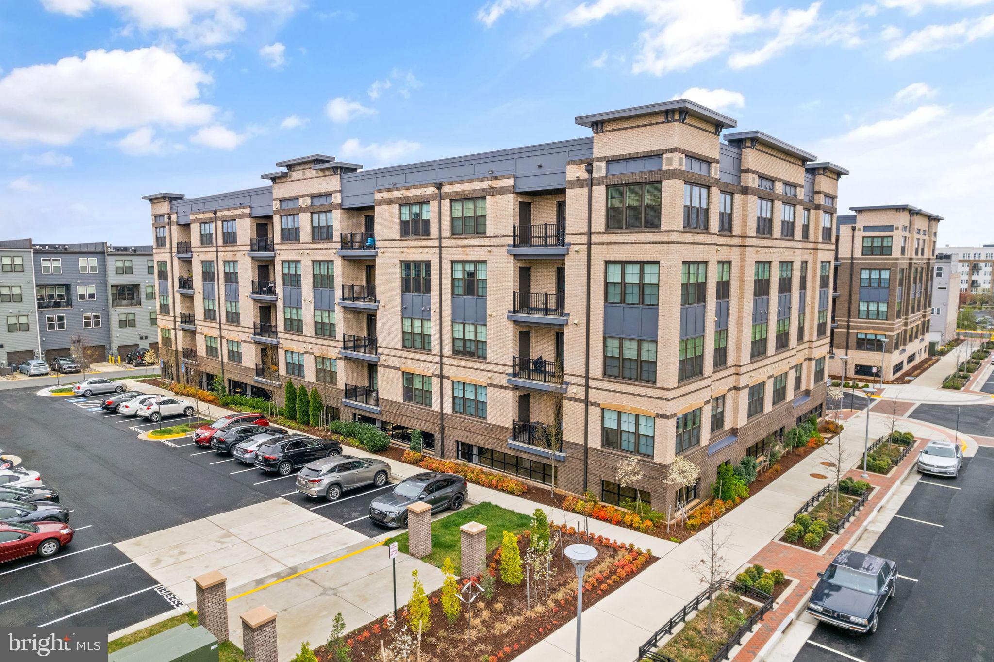 2319 Field Point Road, Unit 401 Herndon, VA 20171 - Photo 3 of 59 Guest parking between buildings w EV charging