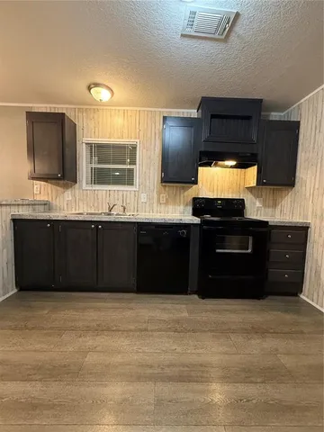 a bathroom with a sink double vanity and a mirror