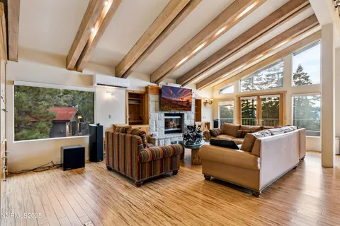 a view of a dining room with furniture wooden floor and chandelier