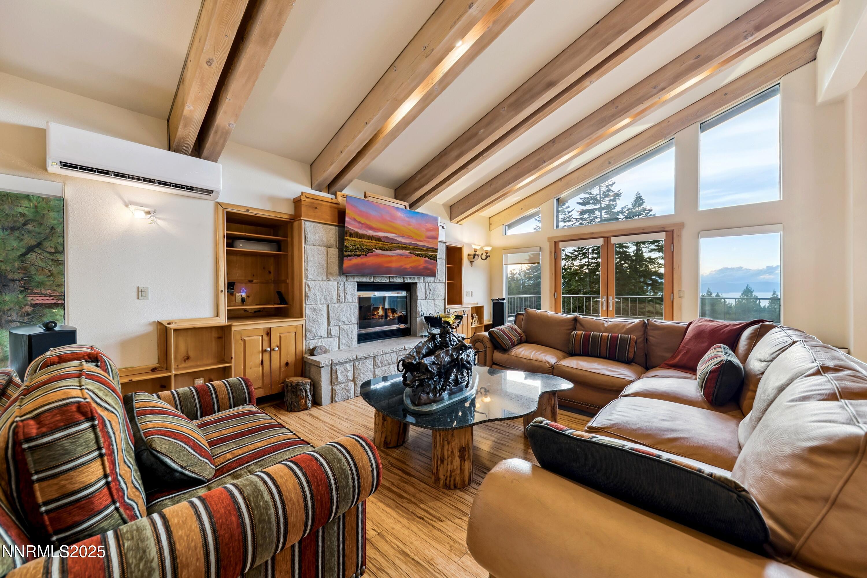 130 Granite Crest Drive Stateline, NV 89449 - Photo 14 of 85 a living room with furniture a fireplace and a large window