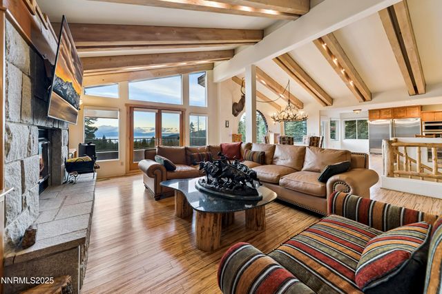 a view of a balcony with wooden fence and floor