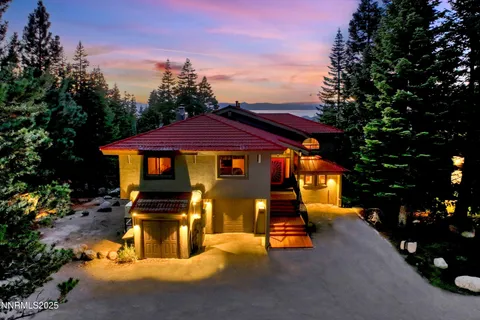 a view of a house with swimming pool and porch