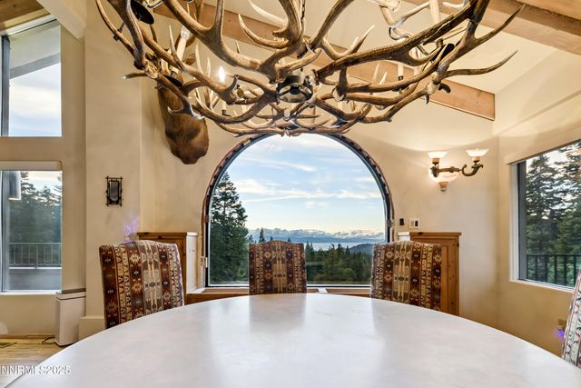 a view of a porch with wooden floor and furniture