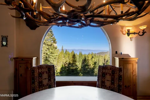a bathroom with a granite countertop toilet a sink and a mirror