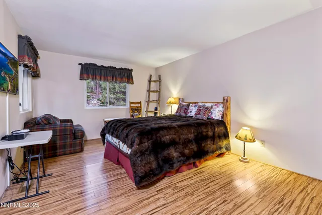 a living room with furniture a piano and a flat screen tv