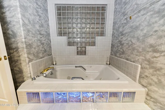 a kitchen with stainless steel appliances granite countertop a refrigerator a stove top oven a sink and dishwasher