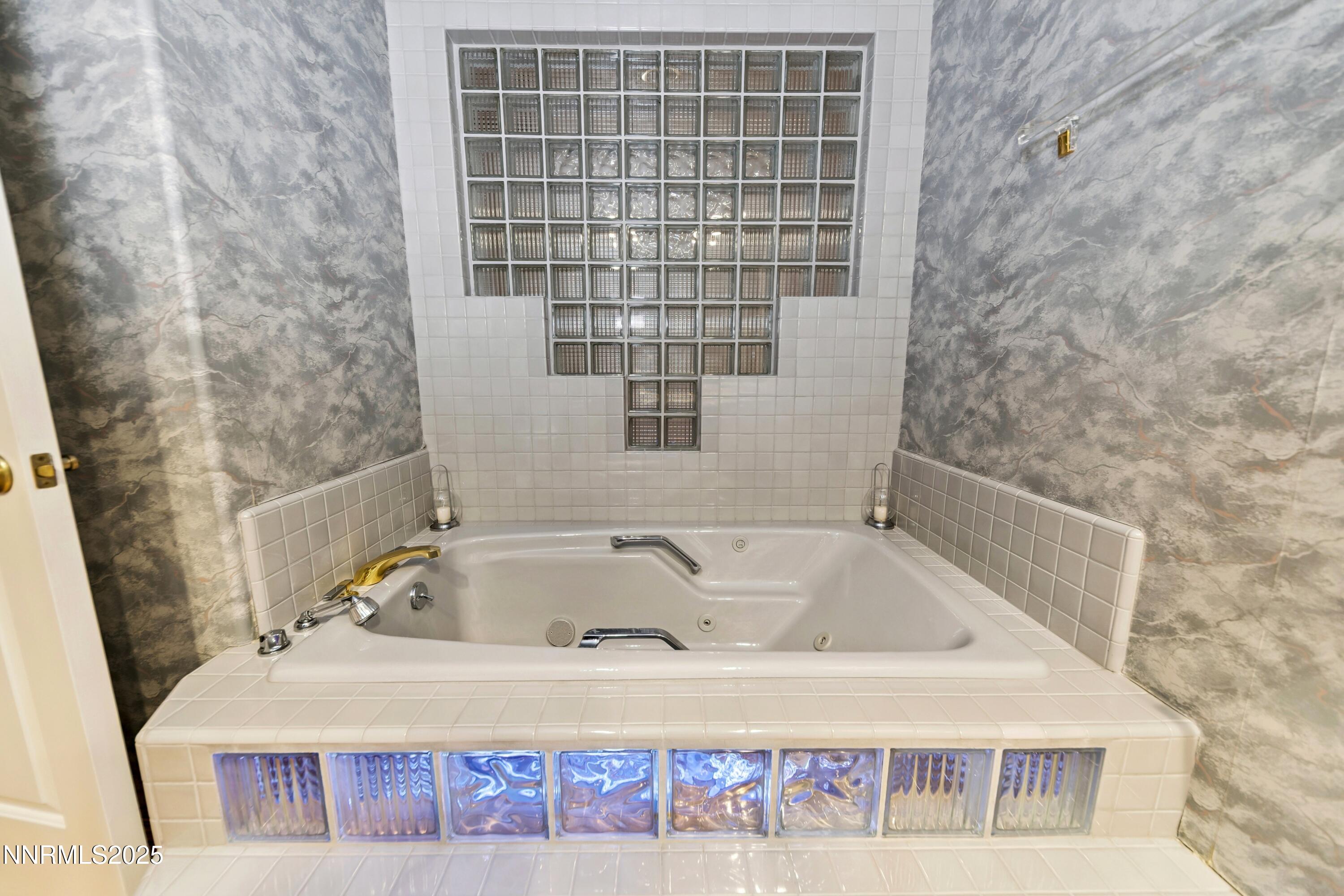 130 Granite Crest Drive Stateline, NV 89449 - Photo 38 of 85 a bathroom with a bathtub and a shower