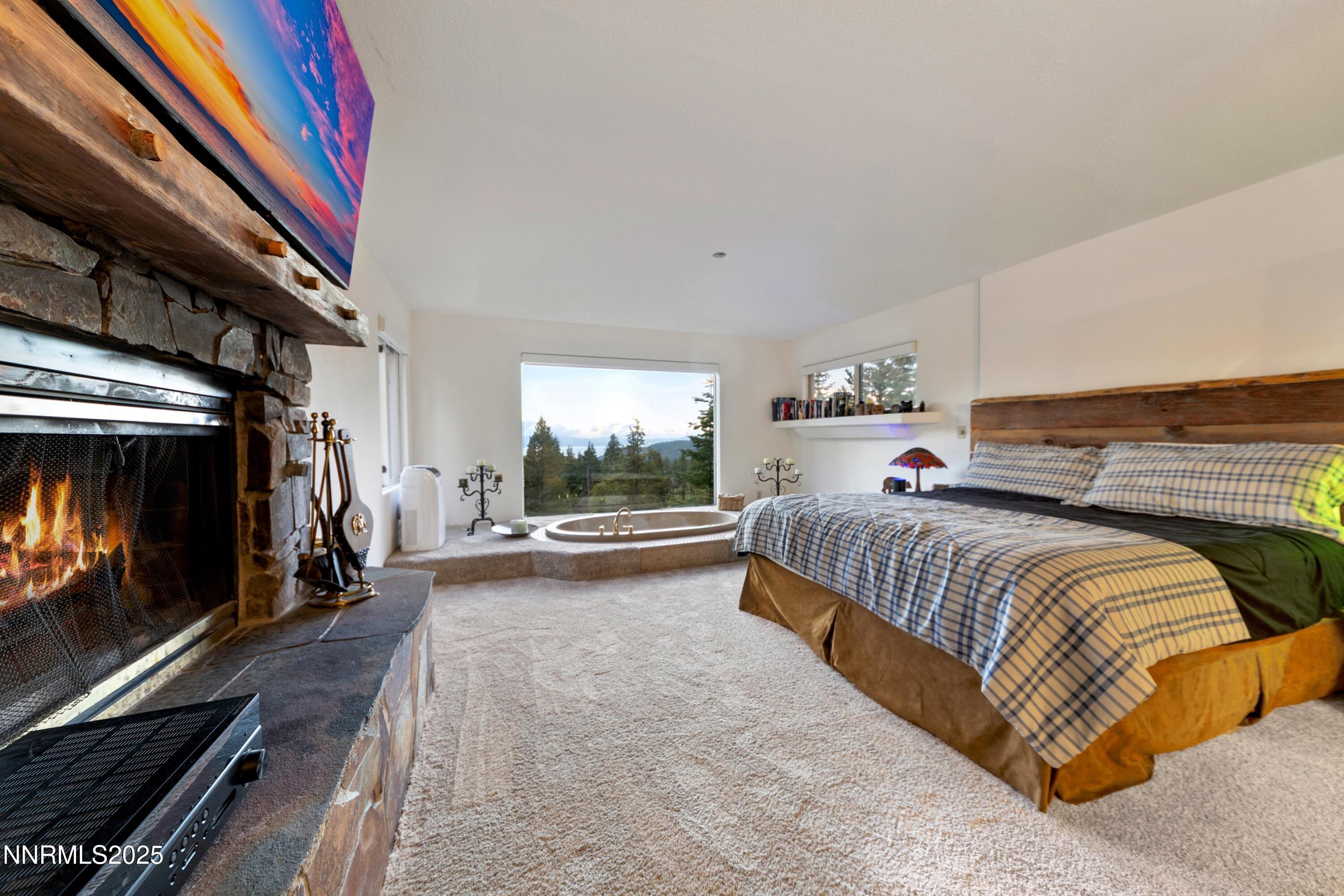 130 Granite Crest Drive Stateline, NV 89449 - Photo 44 of 85 a bed room with a bed and a television