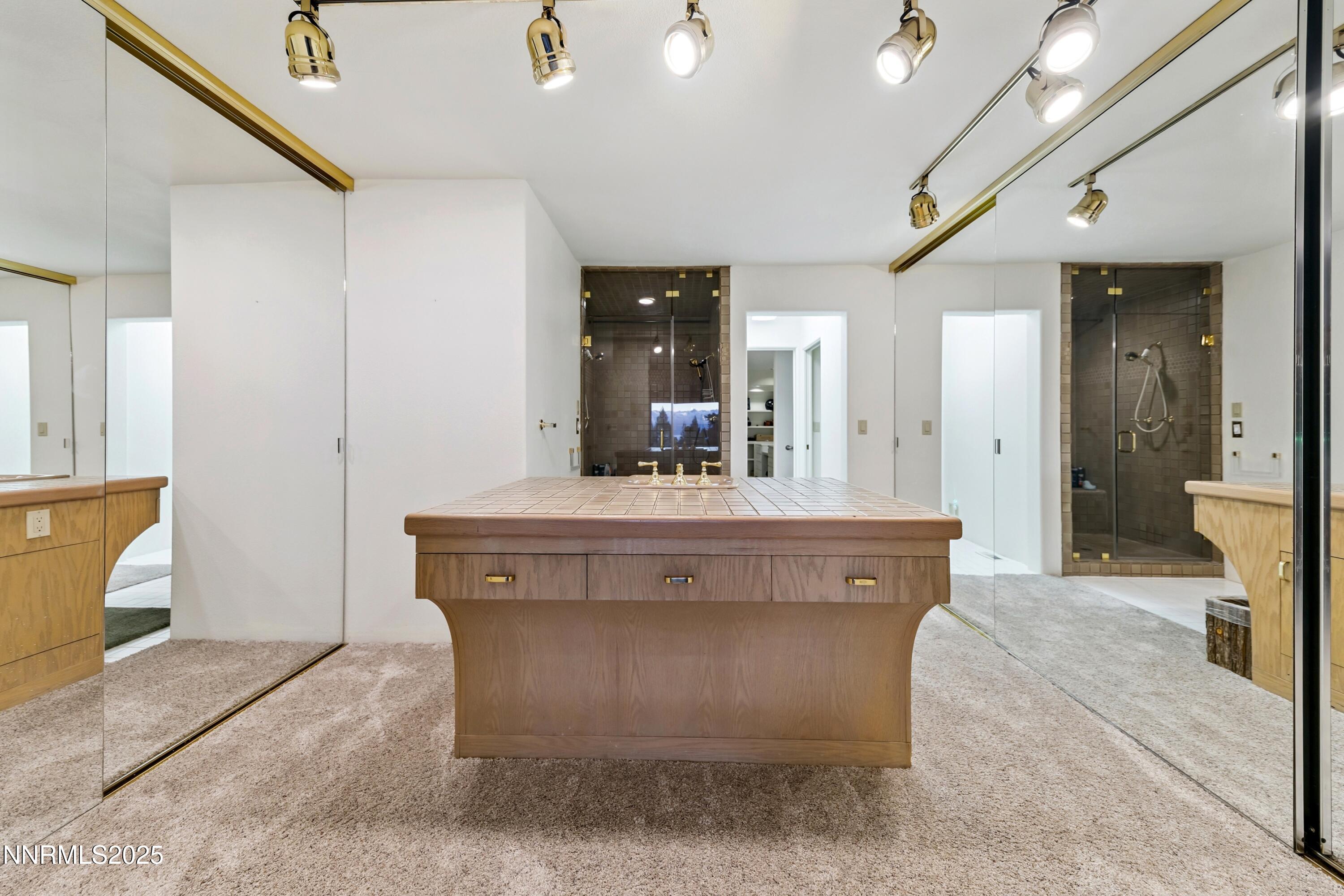 130 Granite Crest Drive Stateline, NV 89449 - Photo 49 of 85 a view of living room with stainless steel appliances kitchen island a chandelier and fireplace